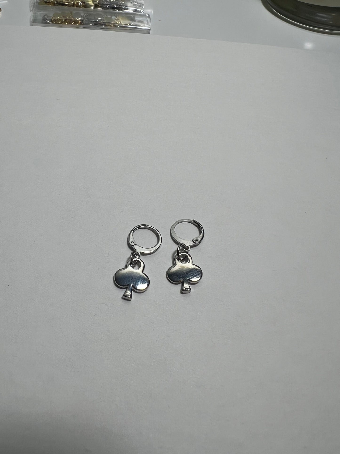 Gold plated club huggie earrings